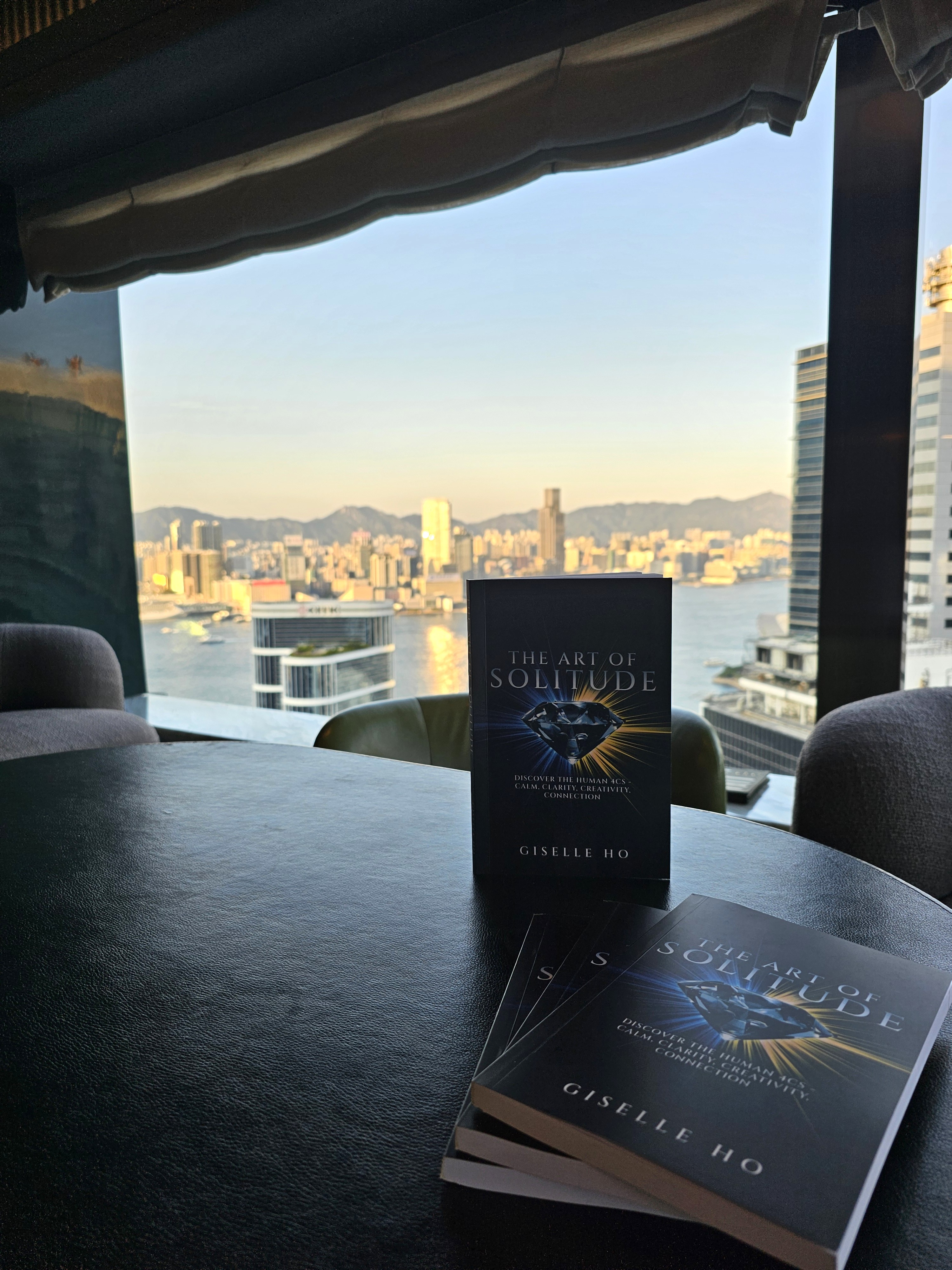 Copies of The Art of Solitude overlooking Hong Kong